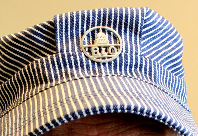 A train engineer's cap with B&O railroad pin.