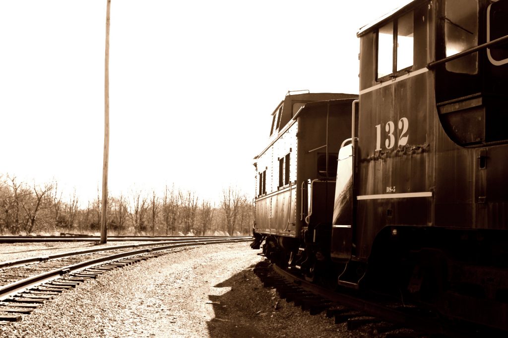 Rolling stock at Hagerstown Roundhouse Museum - locomotive 132, side view, looking down the tracks.