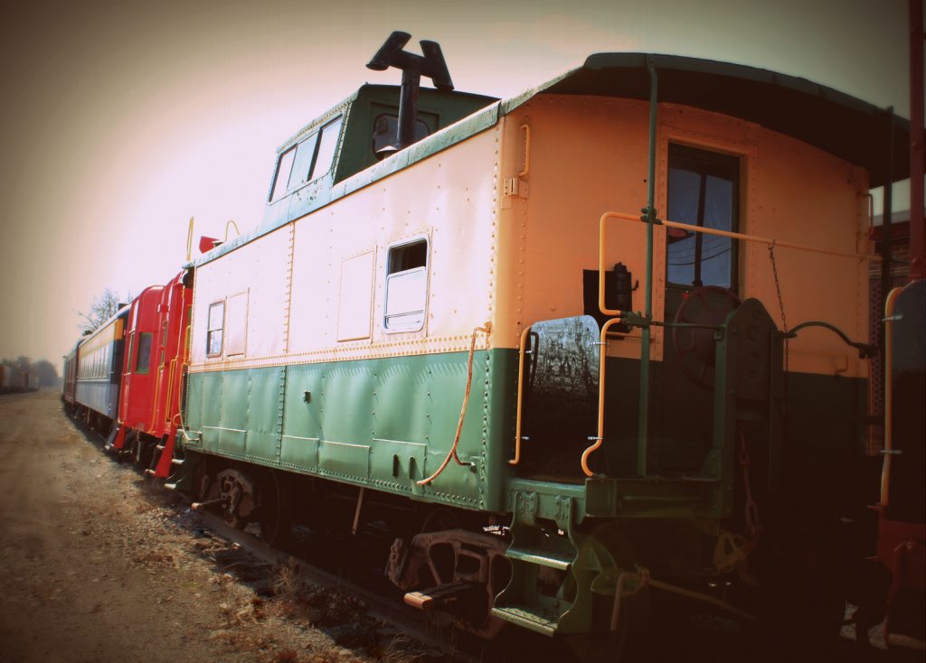 Rolling stock at the museum - a yellow and green caboose.