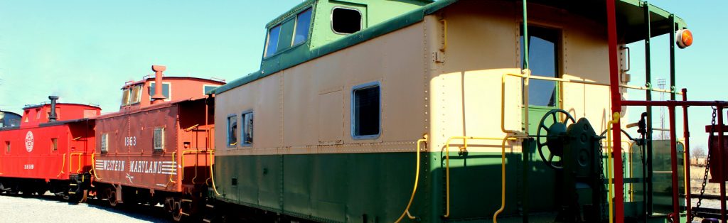 Rolling stock at Hagerstown Roundhouse - a green and yellow caboose.