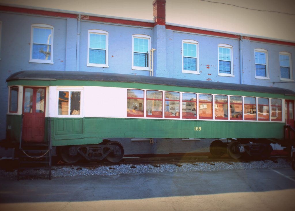 Rolling stock at the Hagerstown Roundhouse Museum green trolly car.