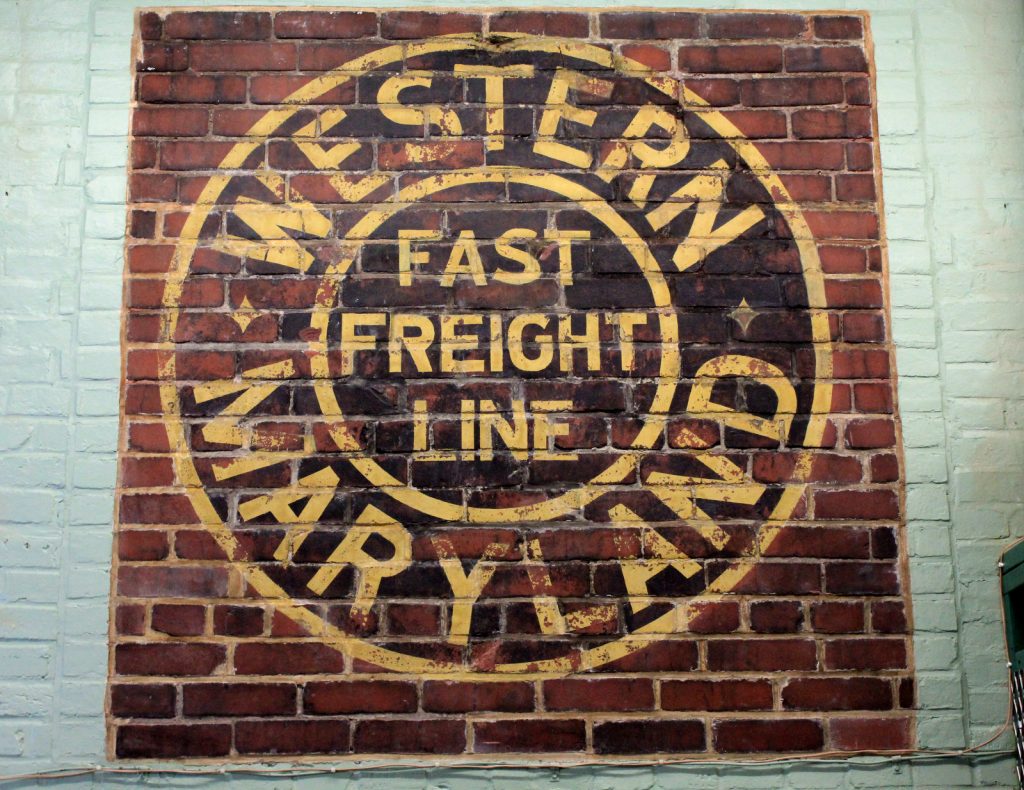 Brick wall inlay of Western Maryland Fast Freight Line Logo