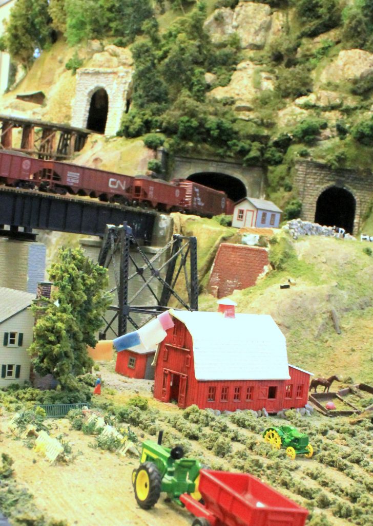 Train cruising into a tunnel - H-O Scale Model Railroad