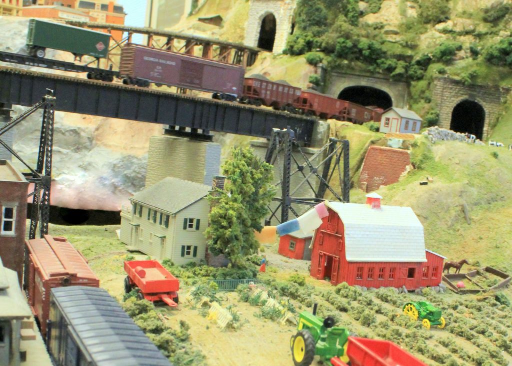 Train cruising into a tunnel - H-O Scale Model Railroad
