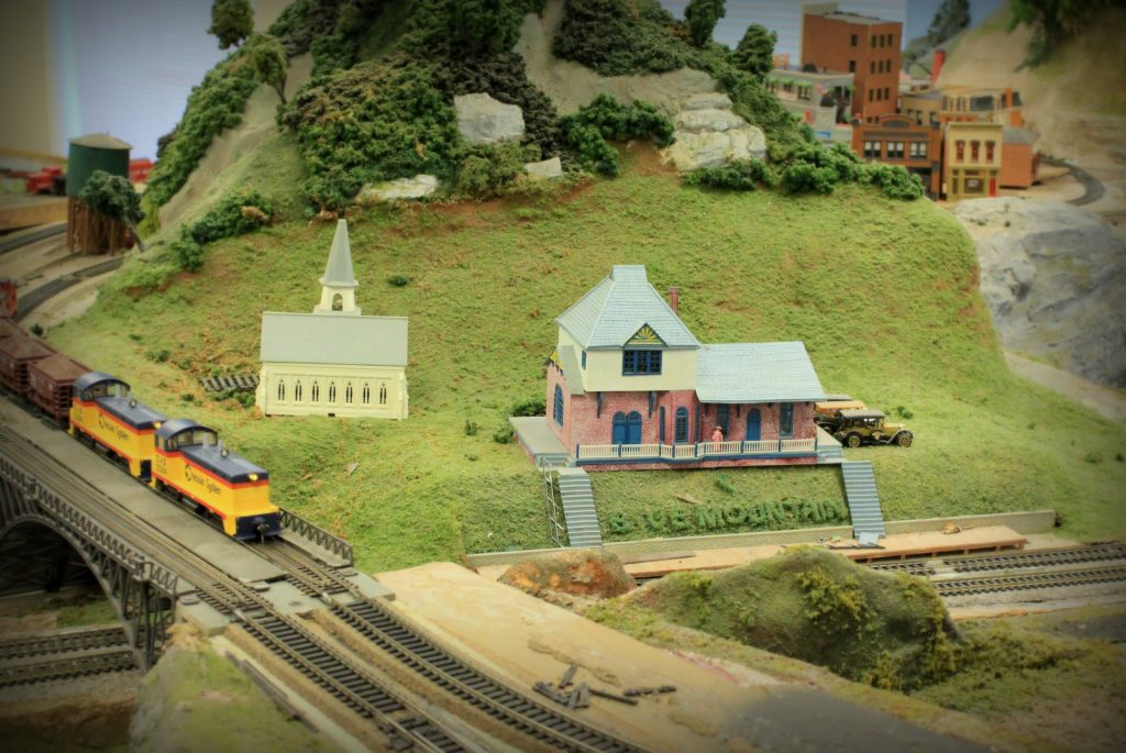 Valley scene with church and Blue Mountain House station - H-O Scale Model Railroad