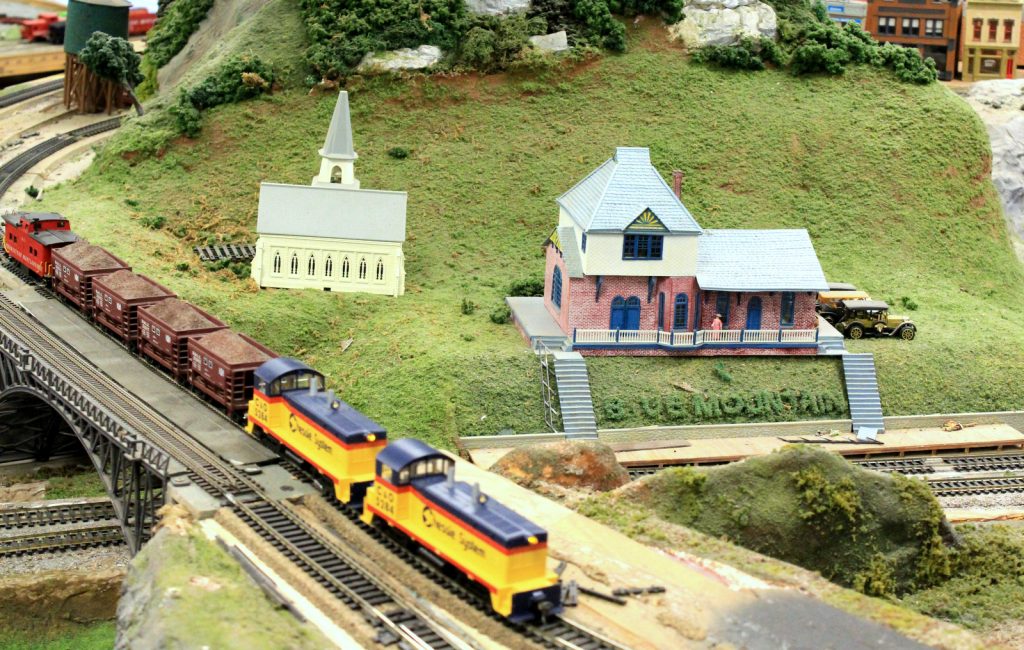 Valley scene with church and Blue Mountain House station - H-O Scale Model Railroad