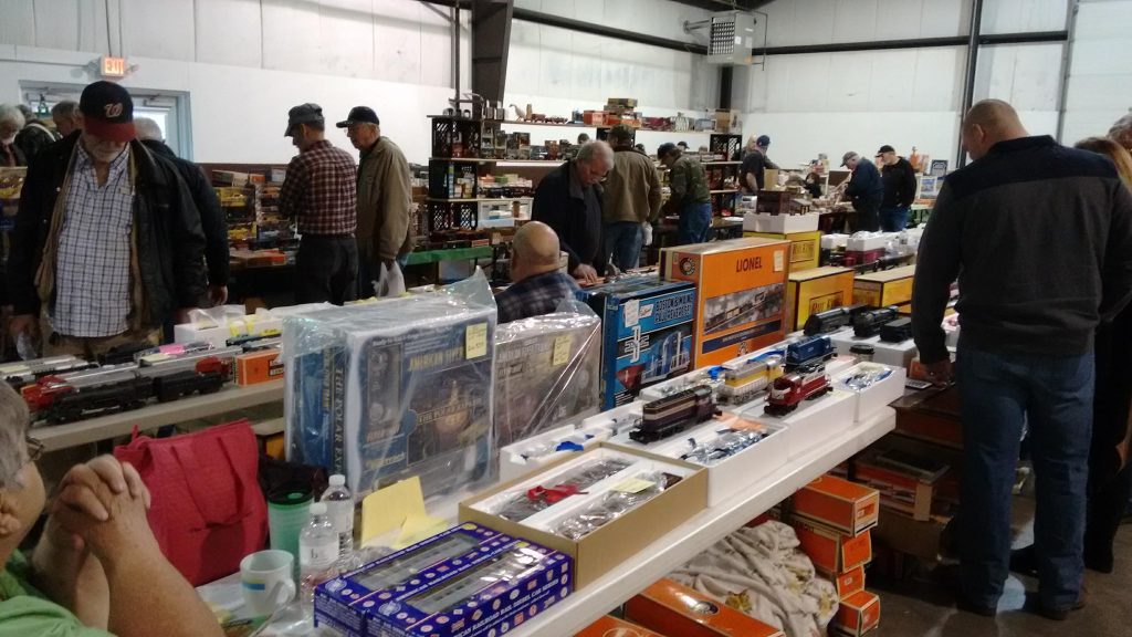 People shopping at a model train show.