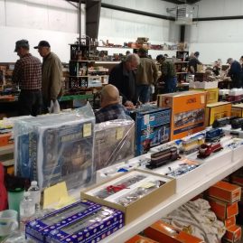 People shopping at a model train show.