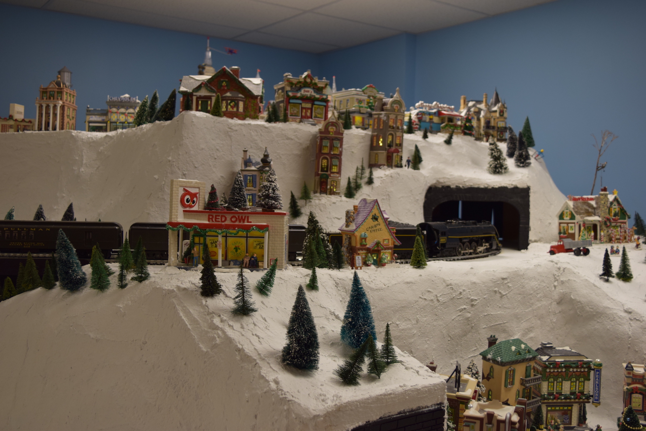 A winter scene in town - Christmas at the Roundhouse" model train display.