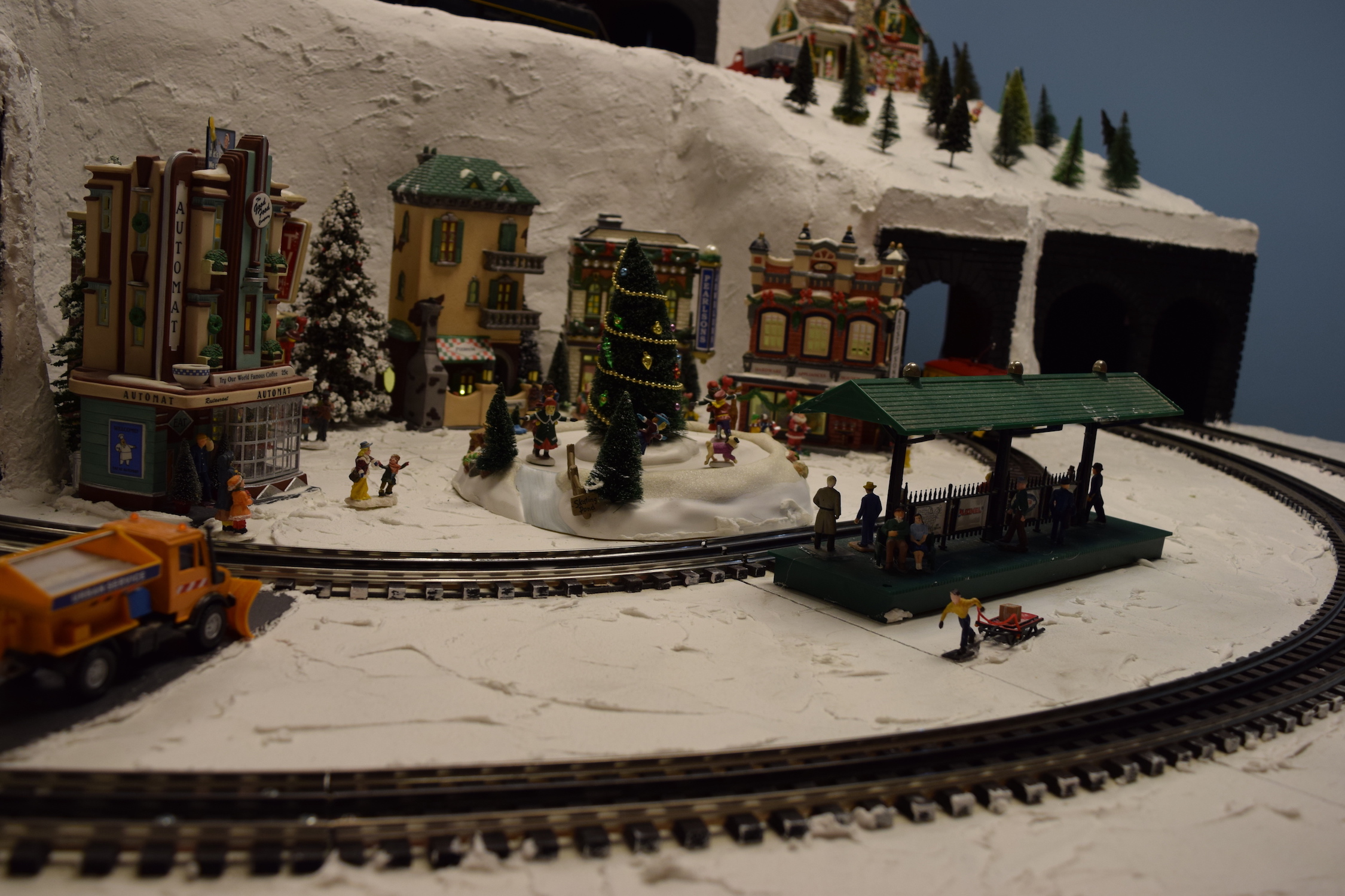 A winter scene in town - Christmas at the Roundhouse" model train display.