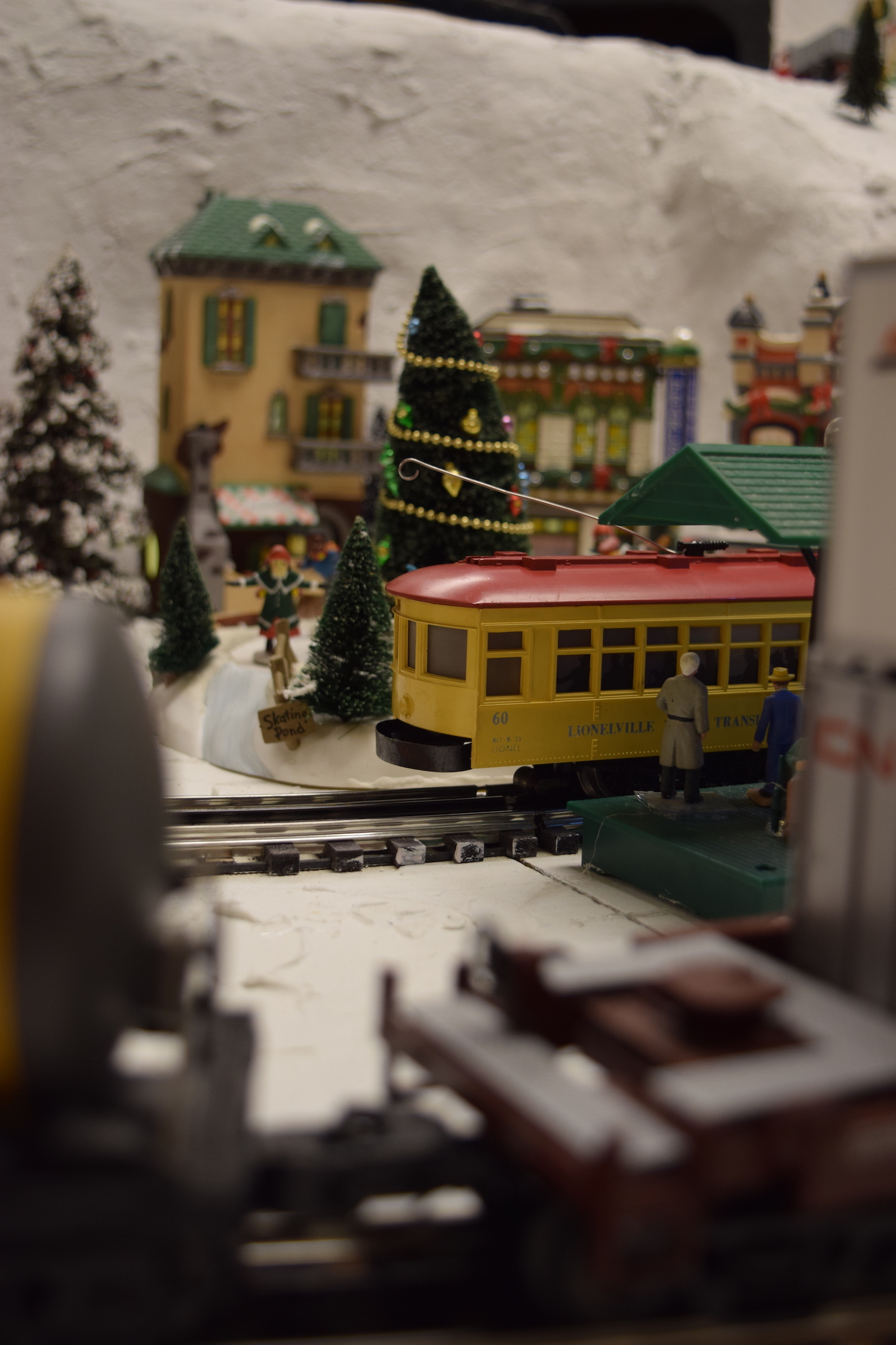 A yellow trolly car - Christmas at the Roundhouse" model train display.