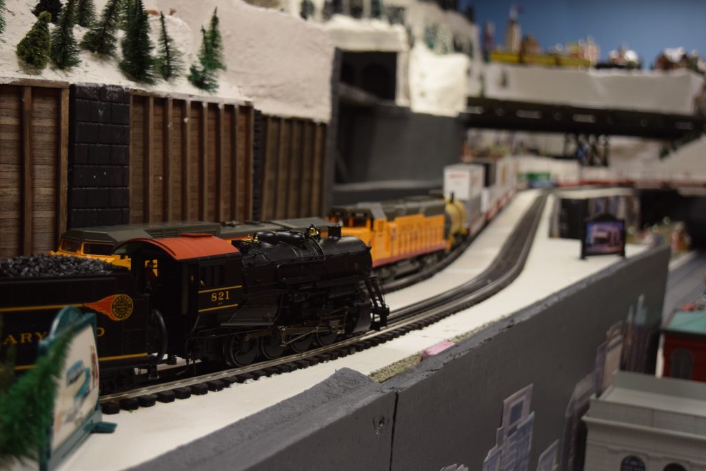 A locomotive passing by - "Christmas at the Roundhouse" model train display.
