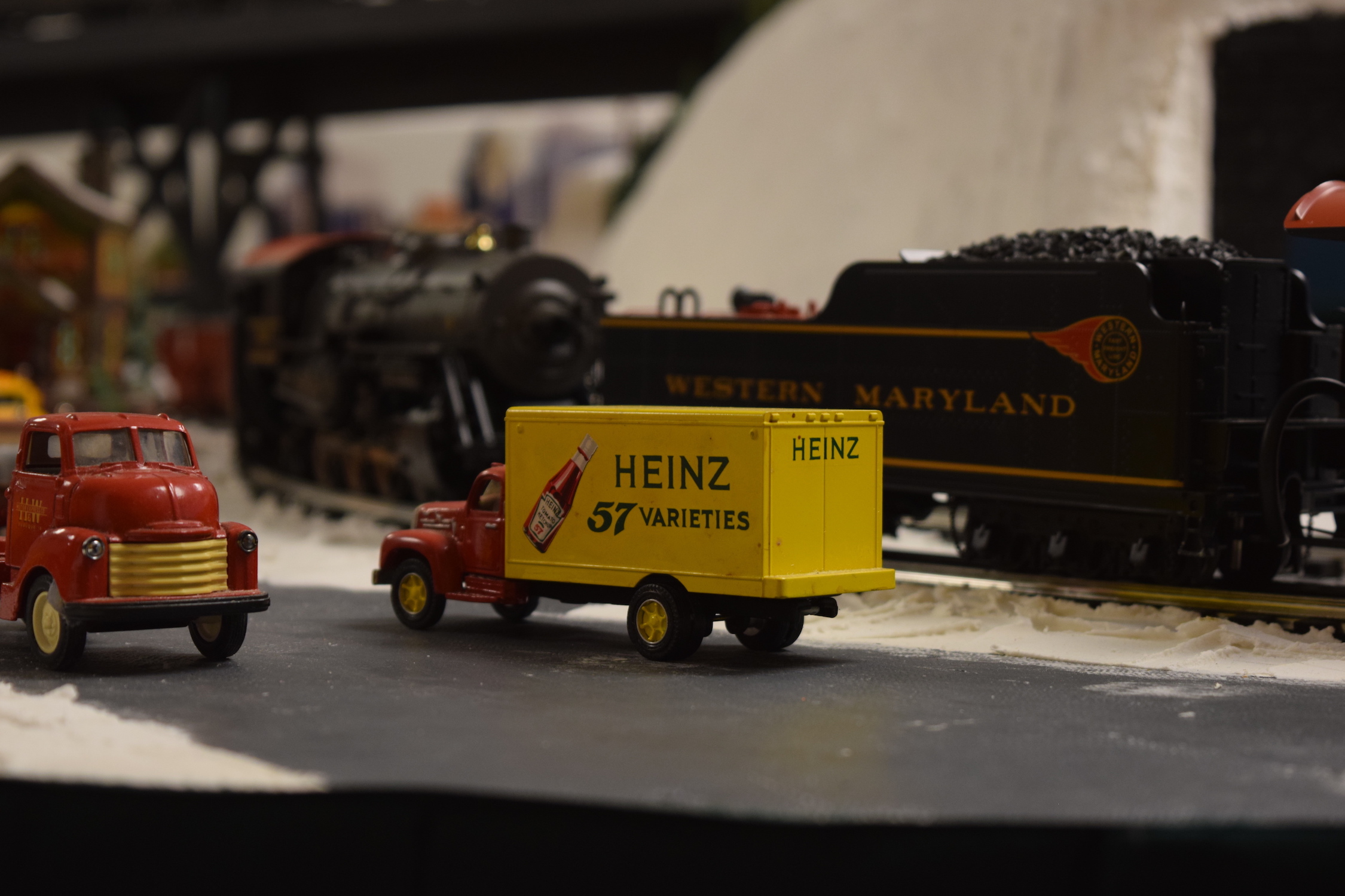 A Heinz 57 yellow delivery truck "Christmas at the Roundhouse" model train display.