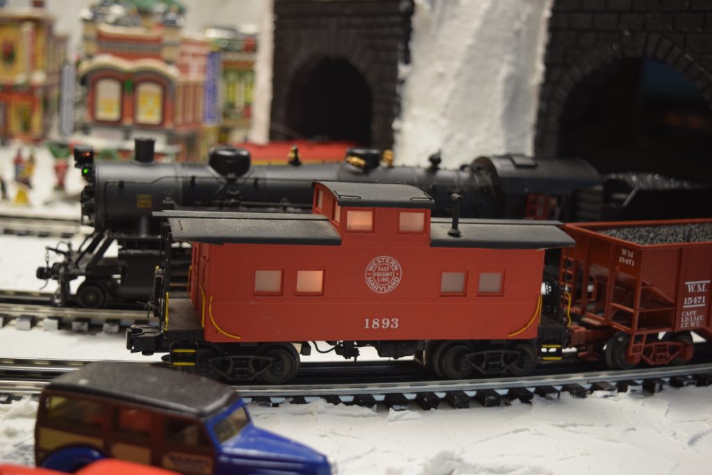A red caboose - "Christmas at the Roundhouse" model train display.