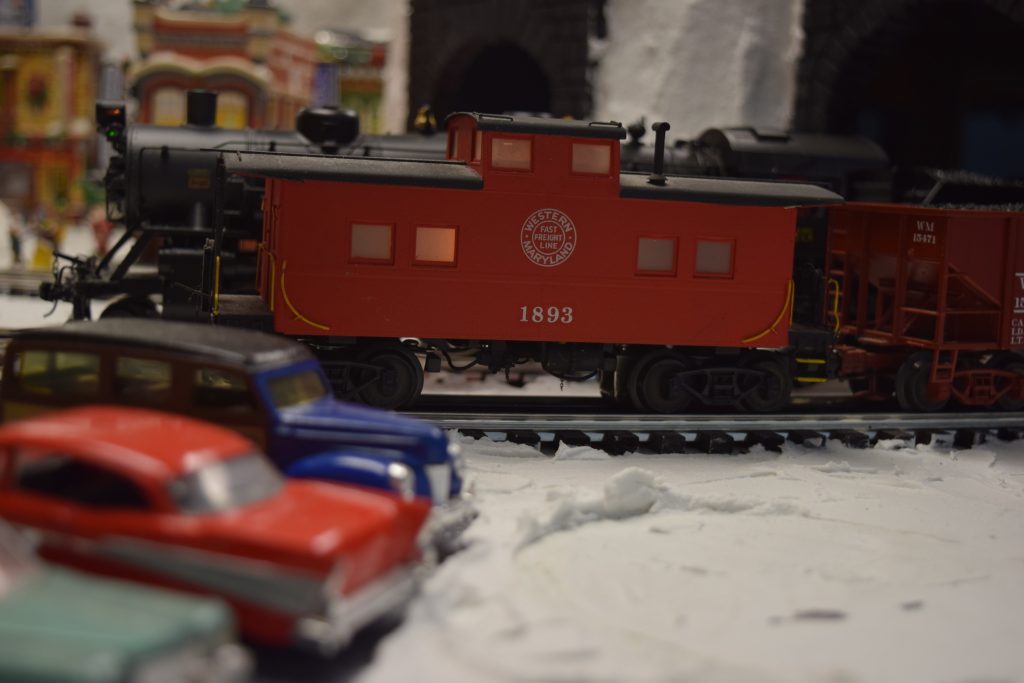 A red caboose - "Christmas at the Roundhouse" model train display.