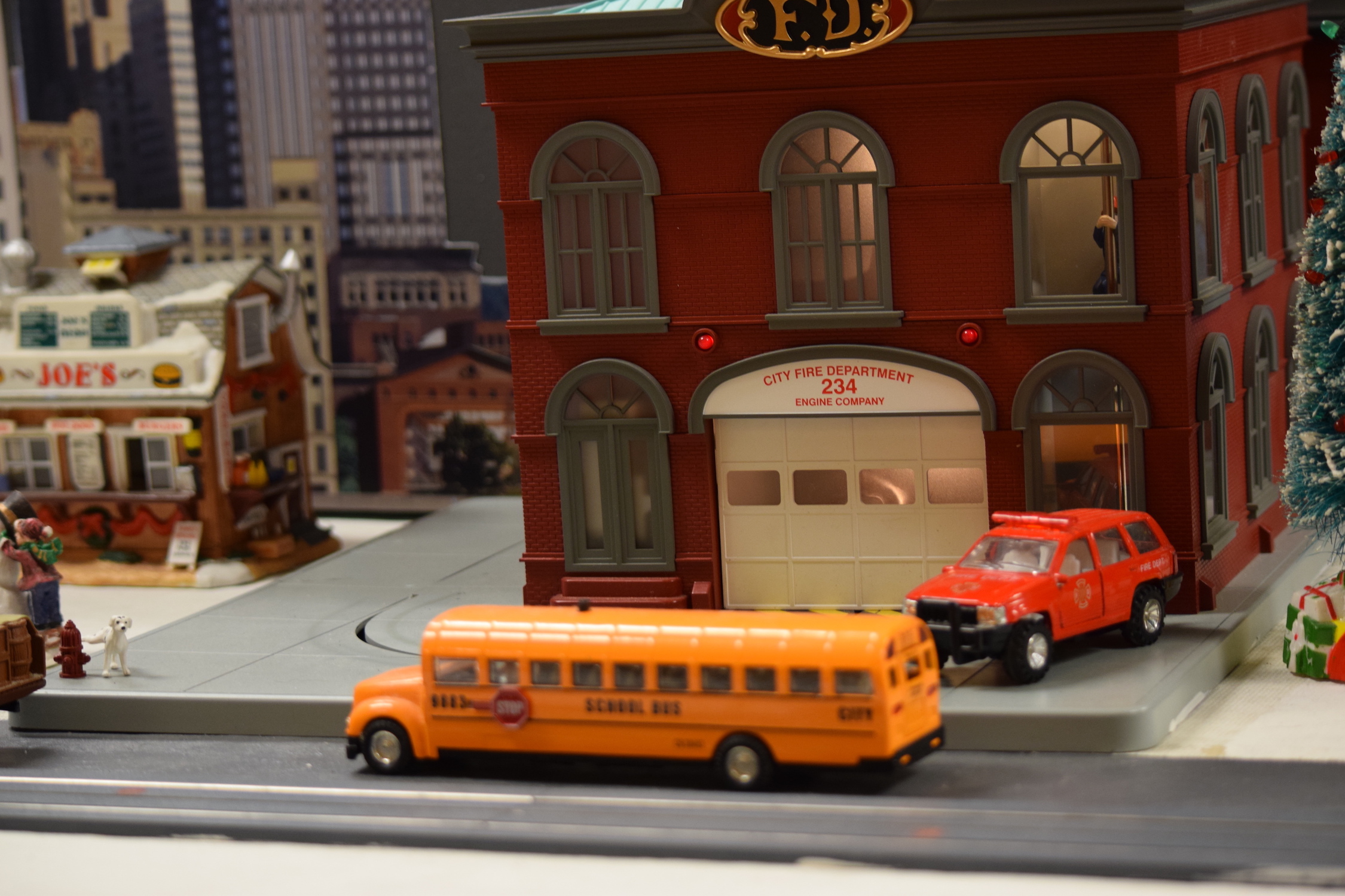 Bus in front of the fire department Building - "Christmas at the Roundhouse" model train display.