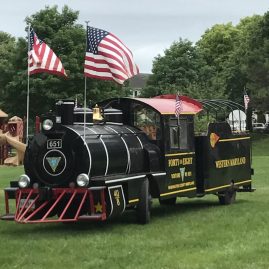 A replica of a Western Maryland steam engine running on tires on top of grass – entertainment during Railroad Heritage Days at the Hagerstown Roundhouse Museum.