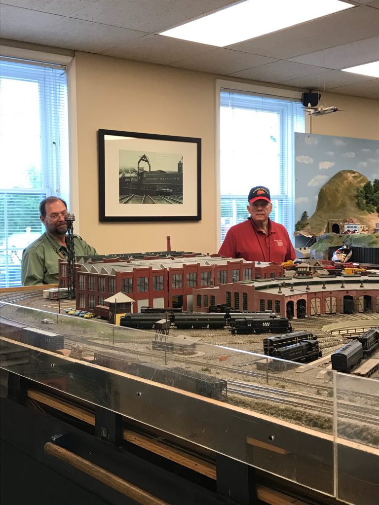 Model train operators at consoles during Railroad Heritage Days at the Hagerstown Roundhouse Museum.
