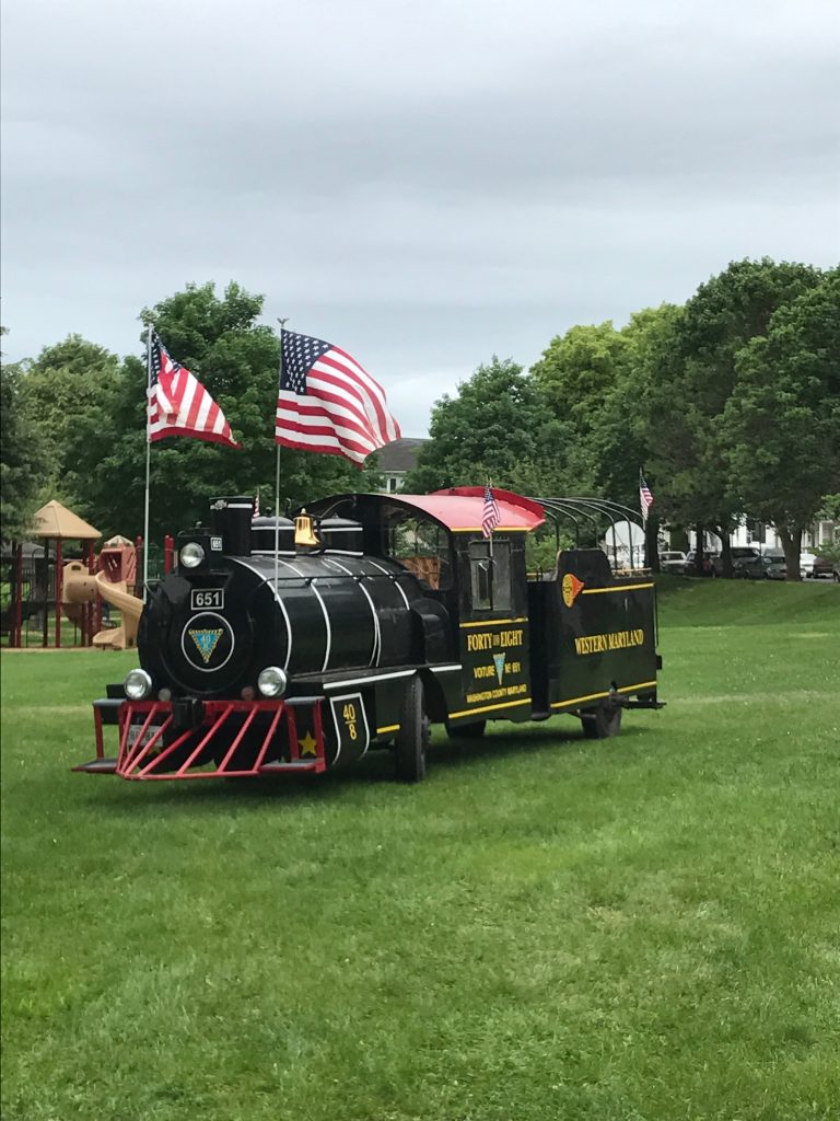 A replica of a Western Maryland steam engine running on tires on top of grass – entertainment during Railroad Heritage Days at the Hagerstown Roundhouse Museum.